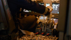 Precision & Reliability in Aerospace: The Test & Measurement Role Aviation crew flying airplane with engine lever to throttle