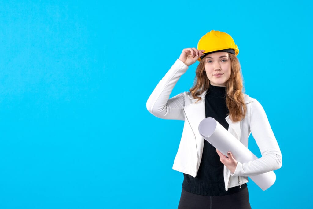 Home 31 front view female architect yellow helmet holding plan blue
