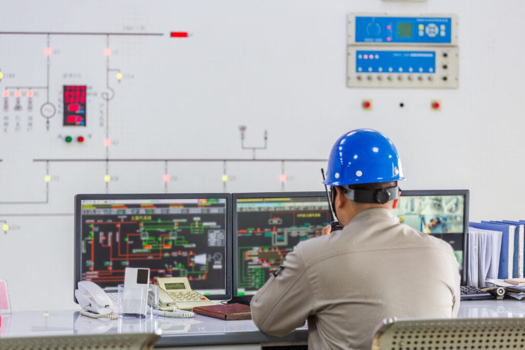 Sustainable Power Management Practices for Modern Industrial Facilities 3 workers control room